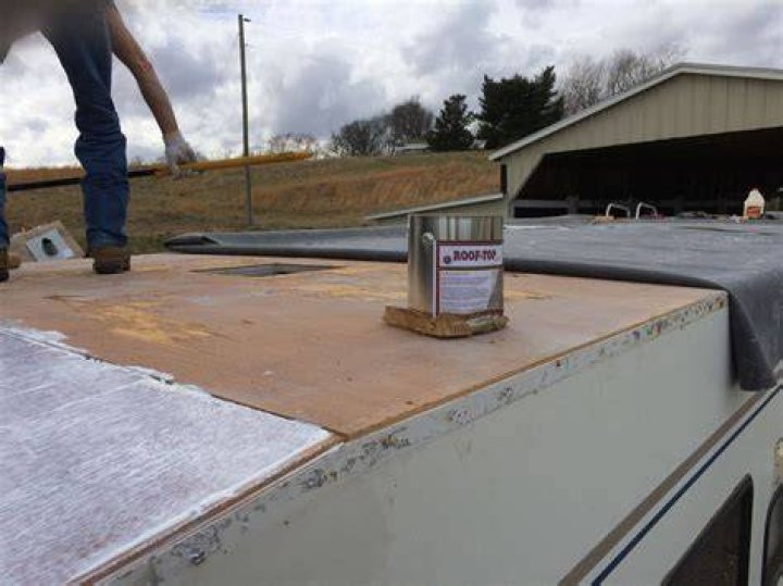 Are rv rubber roofs glued down?